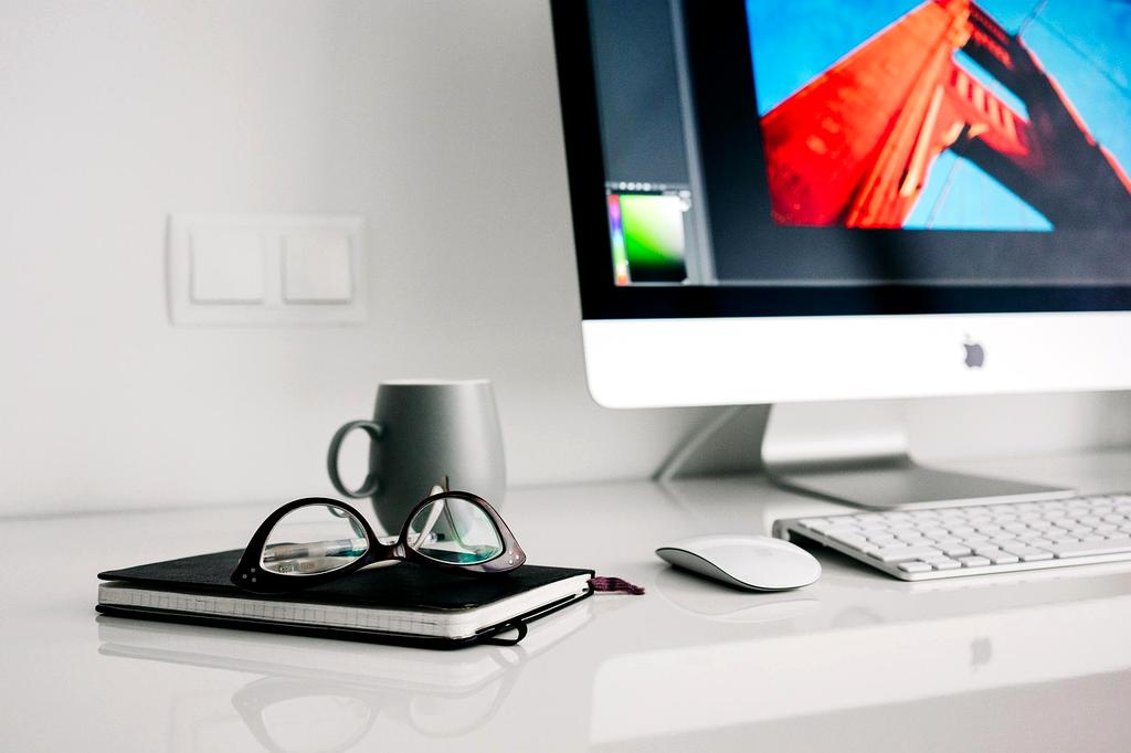 Office desk with ergonomic keyboard and monitor